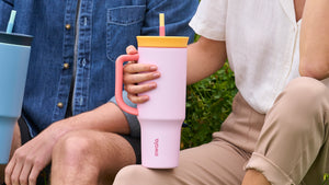 Person holding a Pink 40 oz tumbler